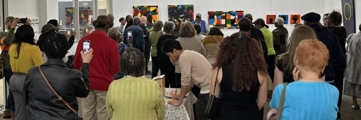 Dr. N. Lee Morris Art Gallery image showing a large crowd of people in the gallery during a showing