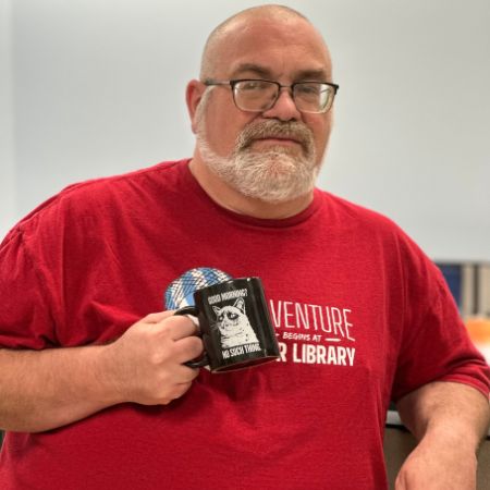 photo of james holding a coffee cup