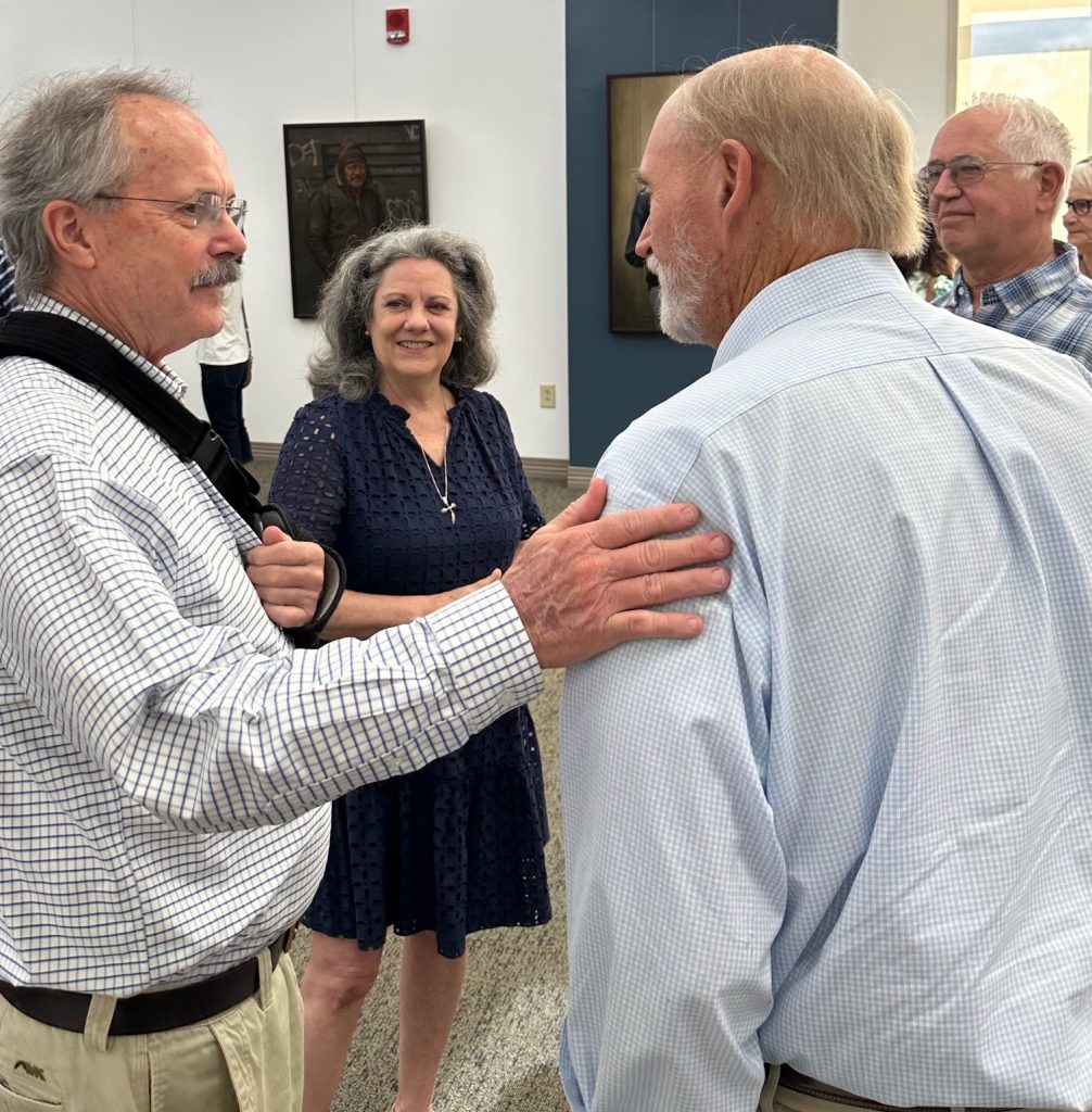 People gathered at art gallery opening of Robert Garey