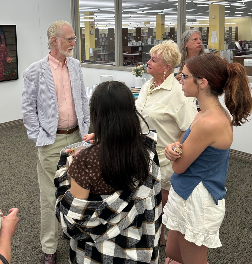 People gathered at art gallery opening of Robert Garey