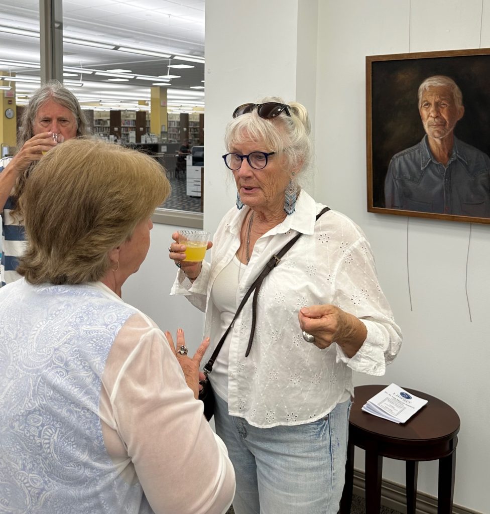 People gathered at art gallery opening of Robert Garey