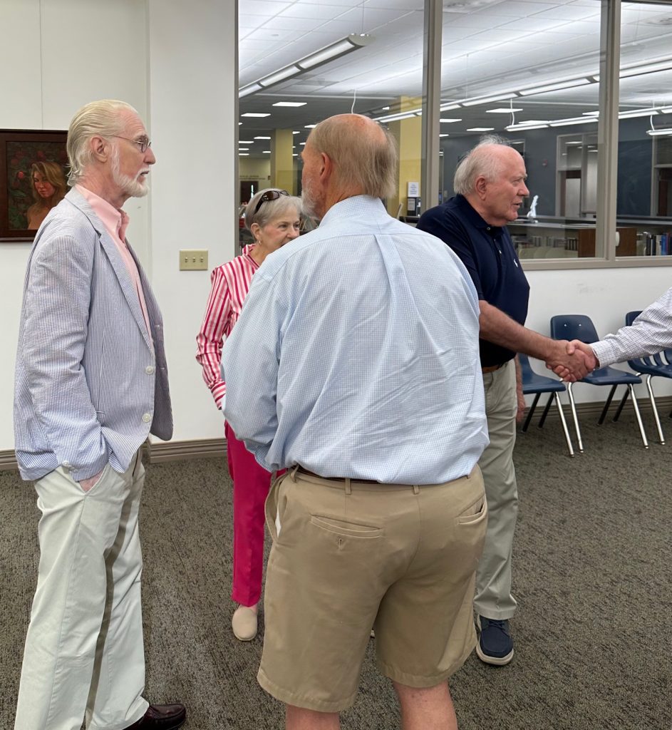 People gathered at art gallery opening of Robert Garey