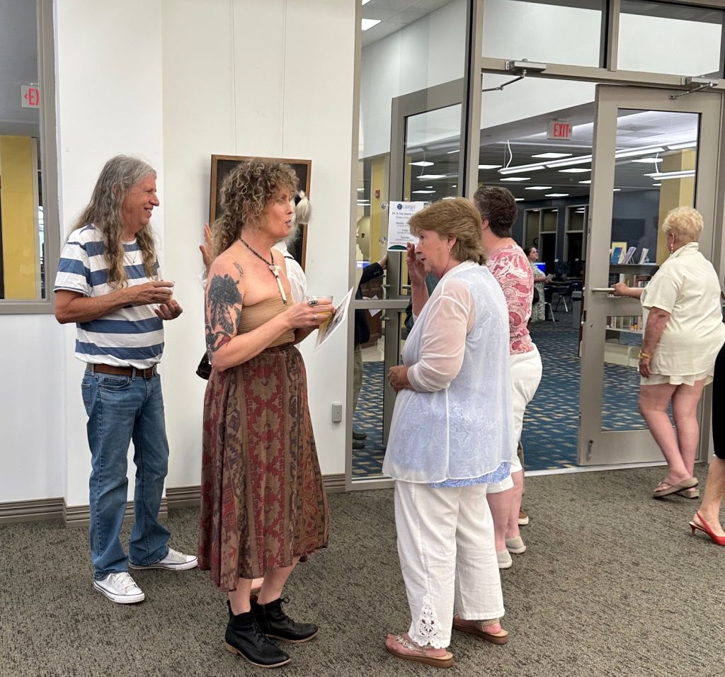 People gathered at art gallery opening of Robert Garey