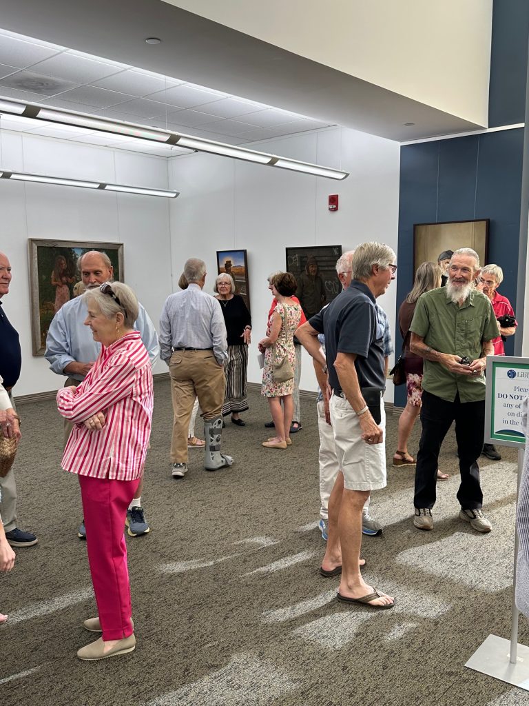 People gathered at art gallery opening of Robert Garey
