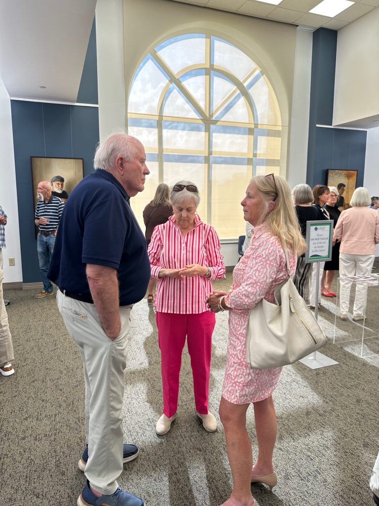 People gathered at art gallery opening of Robert Garey
