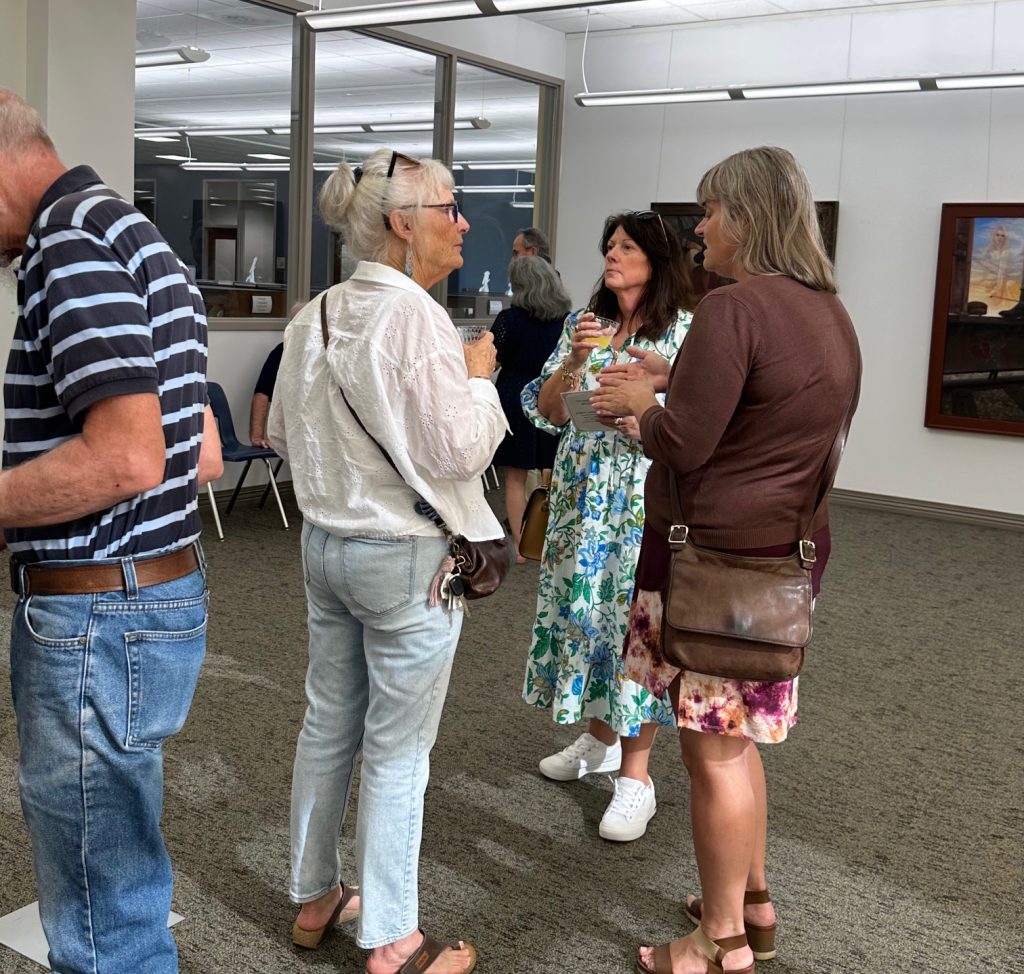 People gathered at art gallery opening of Robert Garey