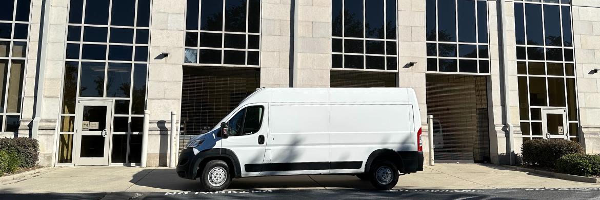 cargo van parked in front of library