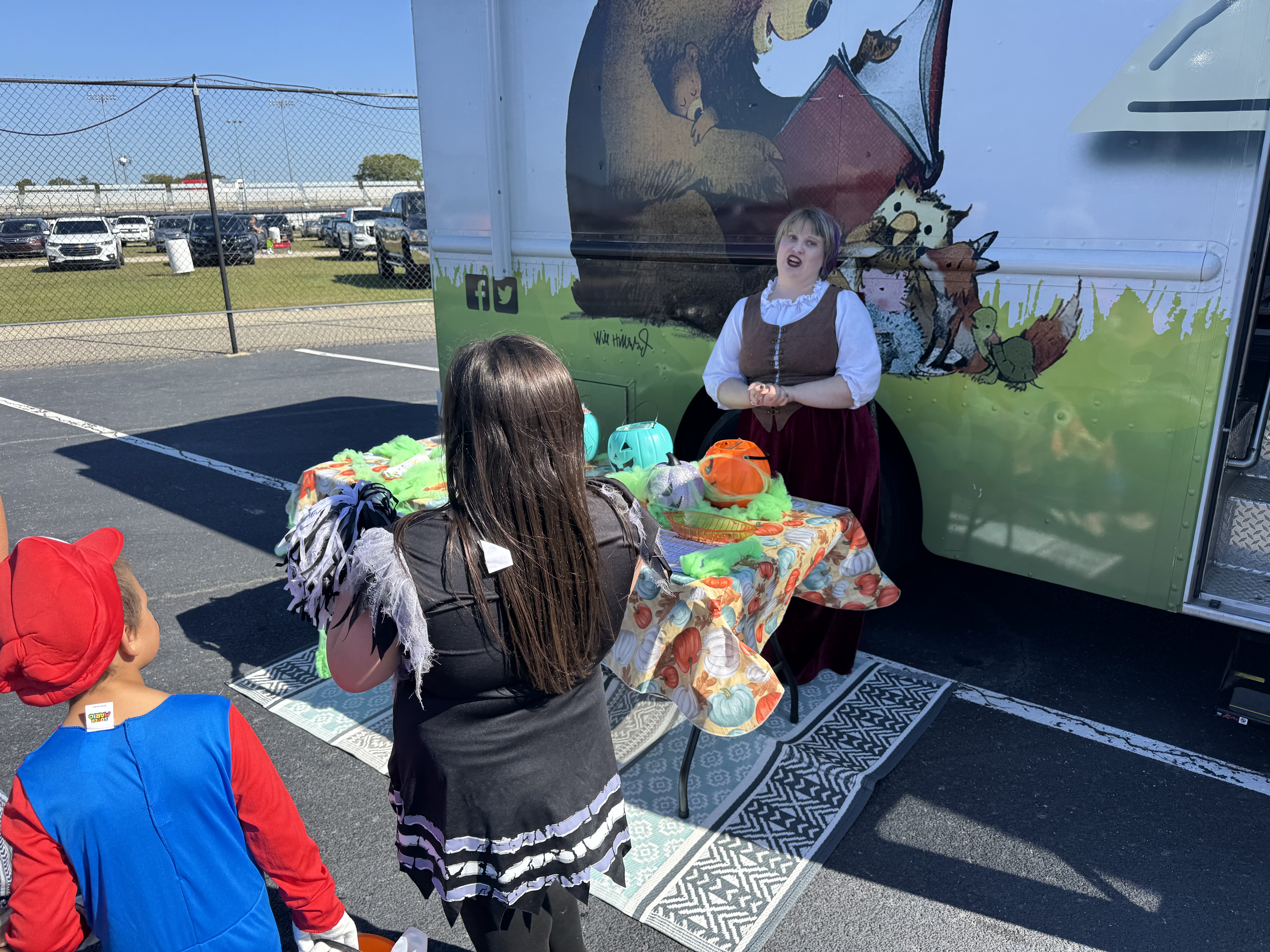 Children lined up to get candy at bookmobile
