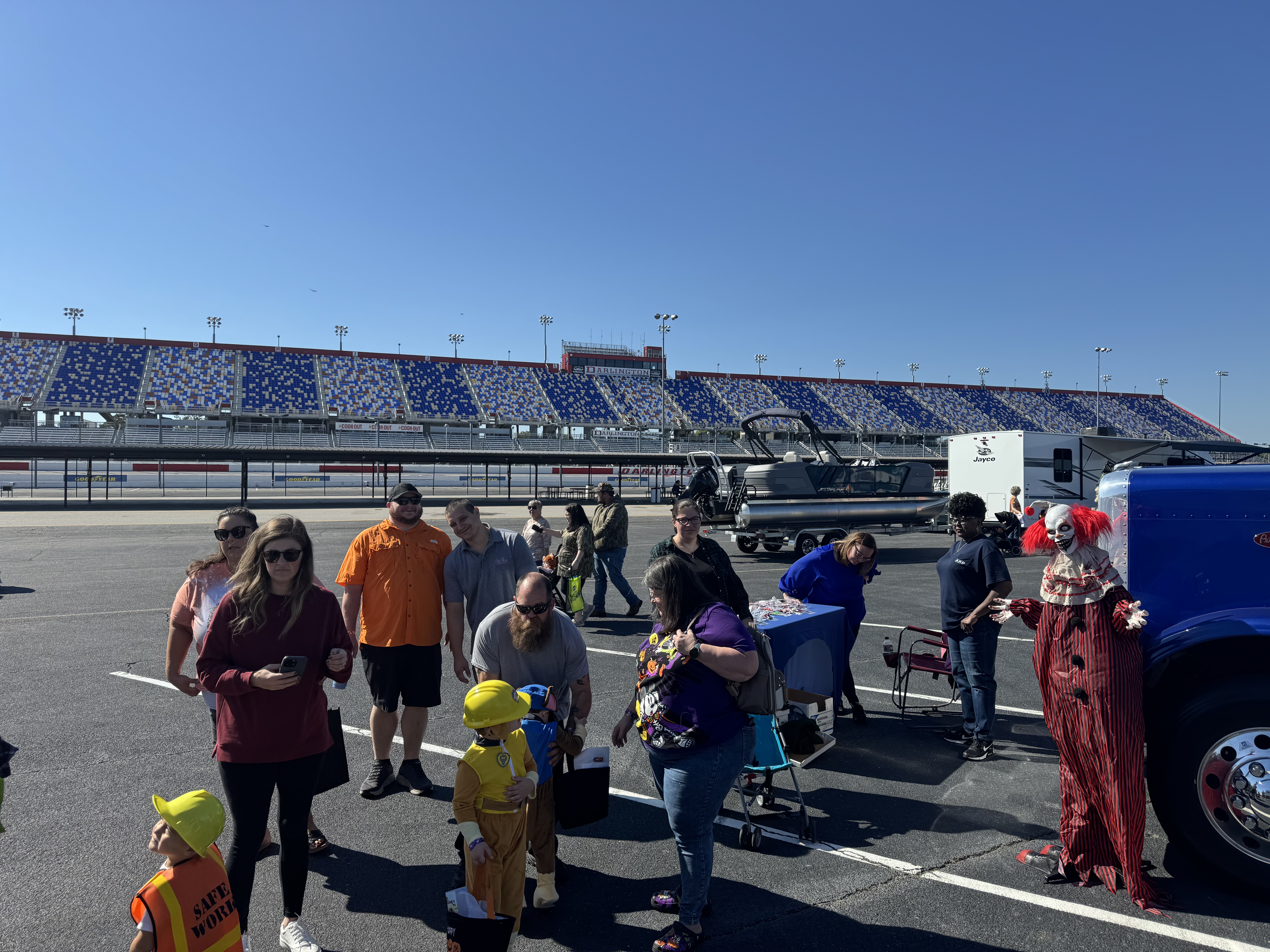 Children lined up to get candy at truck or treat event