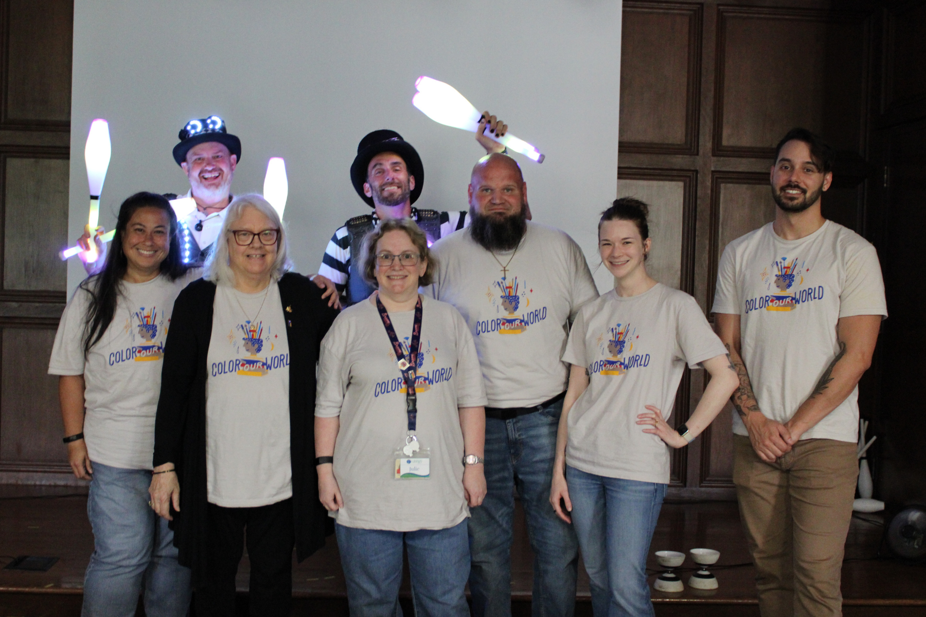 Staff standing in a group with jugglers