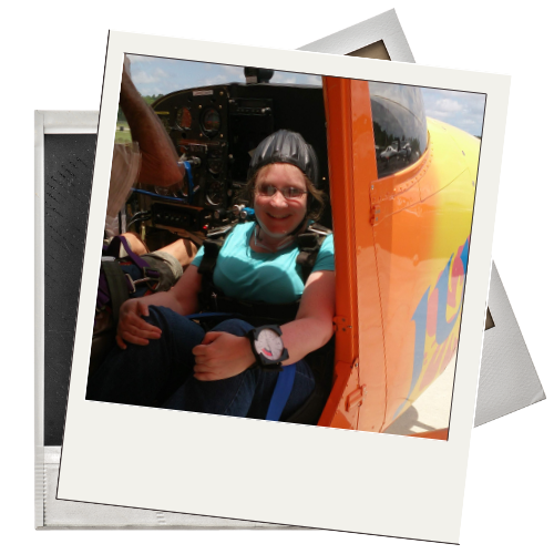 Julie in a plane, ready to skydive