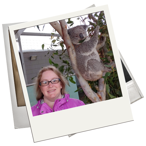 Julie posing in front of a koala bear
