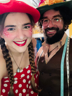Mikaela dressed as a red and white mushroom with her husband dressed as the Mad Hatter