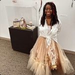 Woman in a fancy dress smiling at the camera