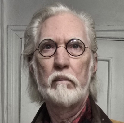 Picture of white male with white hair and beard with glasses