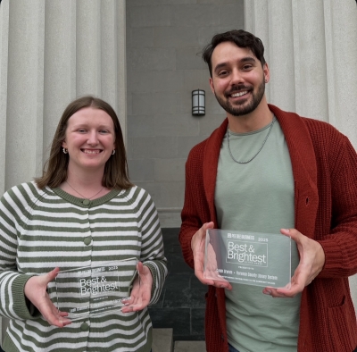 Leah and Caleb holding their Best and Brightest plaques