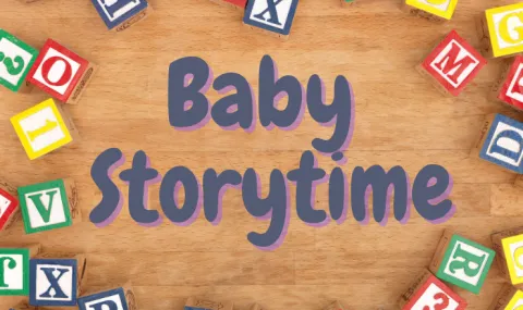 Baby Storytime with scattered alphabet baby blocks in background
