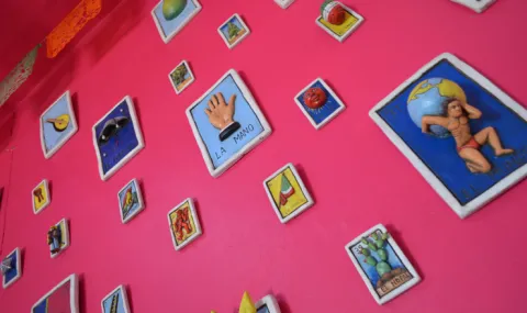 A wall covered in somewhat 3D loteria cards