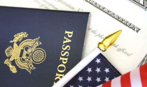 A passport and American flag on a document