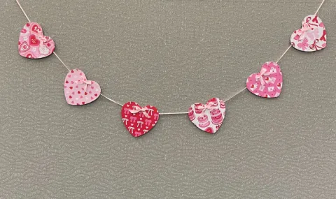 A string garland of hearts in different colors and patterns