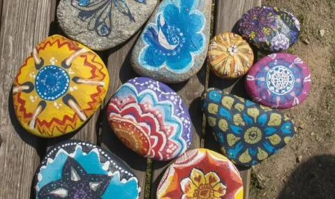 painted rocks on a bench