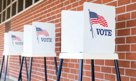 Voting booths lined against a wall