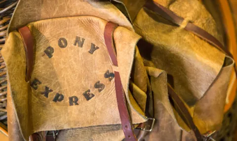 A leather bag labeled "Pony Express"
