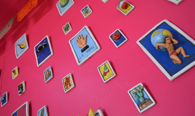 A wall covered in somewhat 3D loteria cards