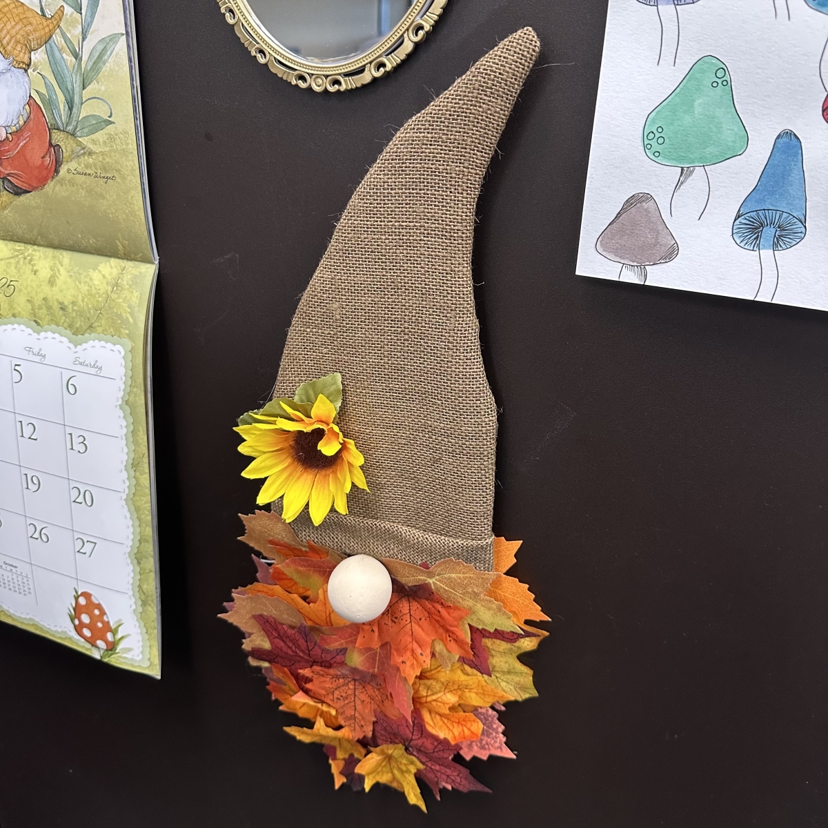 Gnome door hanger made with burlap, leaves, and a flower