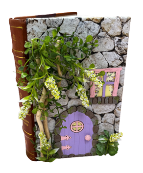 Picture of a book decorated to look like a fairy house