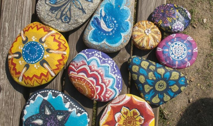 painted rocks on a bench