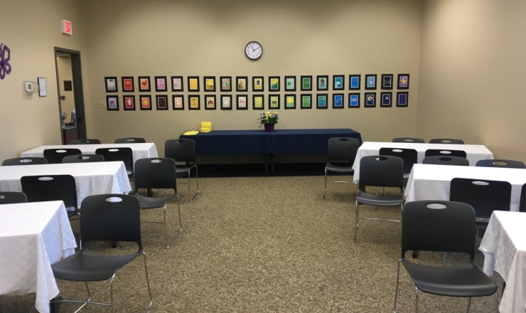 JV Meeting Room interior showing rows of tables with white tablecloths